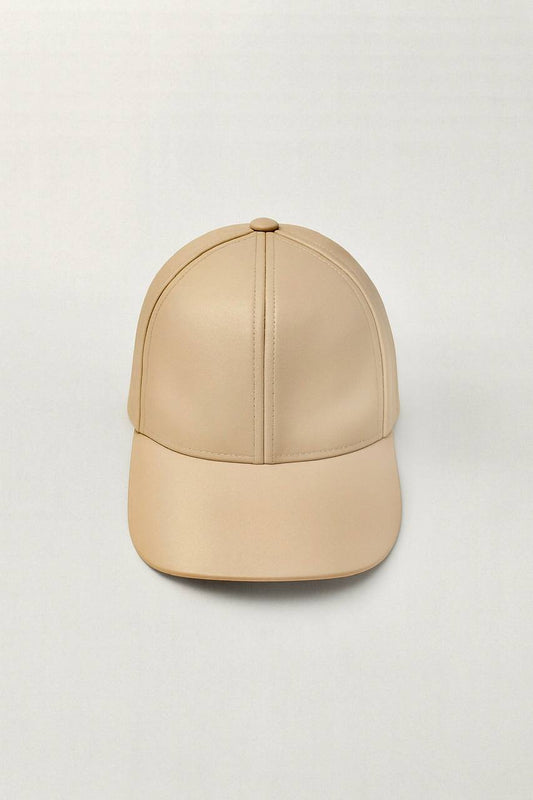 Beige baseball cap on a light gray background